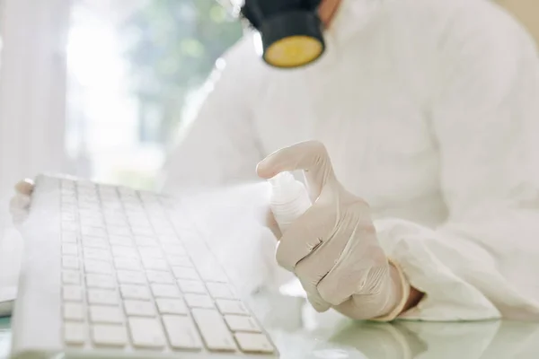 depositphotos_381926690-stock-photo-technician-spraying-frequently-touched-computer